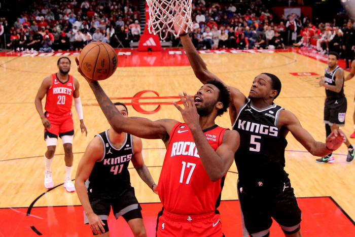 Rockets forward Tari Eason scores inside against Sacramento Kings guard De'Aaron Fox (5) during the fourth quarter at Toyota Center.